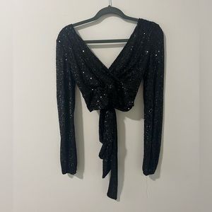 New Year Eve sparkly black long sleeve top.